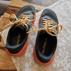 Altra Trail Running Shoes in Gray with Orange Soles and Yellow Laces